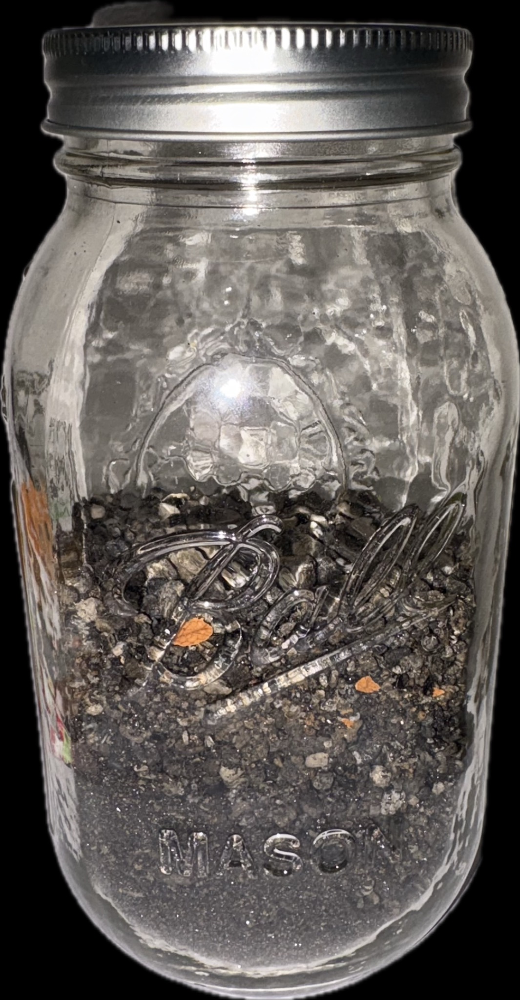 Iwo Jima sand specimen in a container